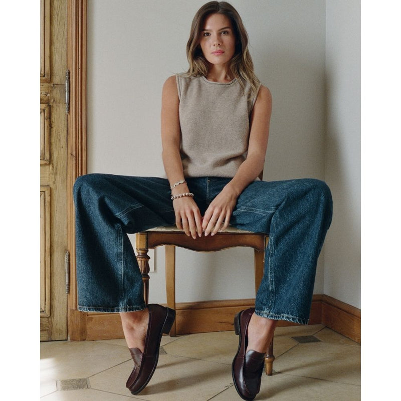 Burgundy leather penny loafers with a polished finish, classic moccasin stitching, and a low stacked heel. A timeless staple for effortless sophistication.