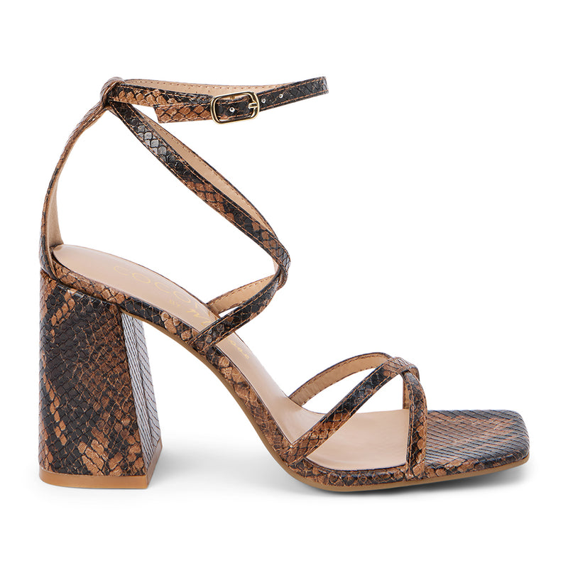 Women's brown snakeskin strappy block heel sandal with a square toe and adjustable ankle strap, featuring a textured faux reptile finish for a bold statement look