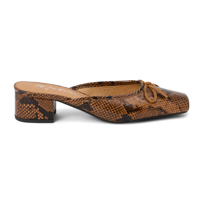 Stylish brown snake print mule heel with a square toe and bow detail. Trendy and versatile for any wardrobe.