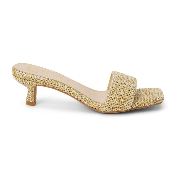 A refined blend of texture and elegance, these natural woven kitten heel mules feature a raffia-inspired design, a square toe, and a low-profile heel. A breezy, sophisticated choice for warm-weather dressing.