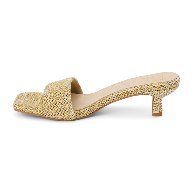 A refined blend of texture and elegance, these natural woven kitten heel mules feature a raffia-inspired design, a square toe, and a low-profile heel. A breezy, sophisticated choice for warm-weather dressing.