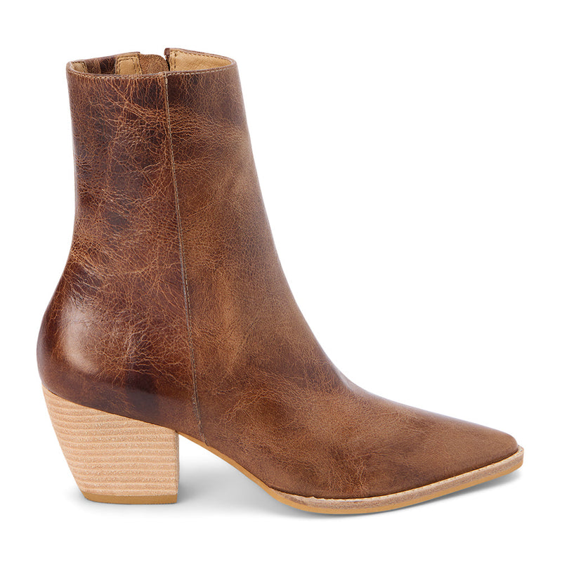 Distressed brown leather ankle boots with a pointed toe, stacked block heel, and vintage-inspired finish. A modern take on a classic Western silhouette, perfect for effortless everyday wear.