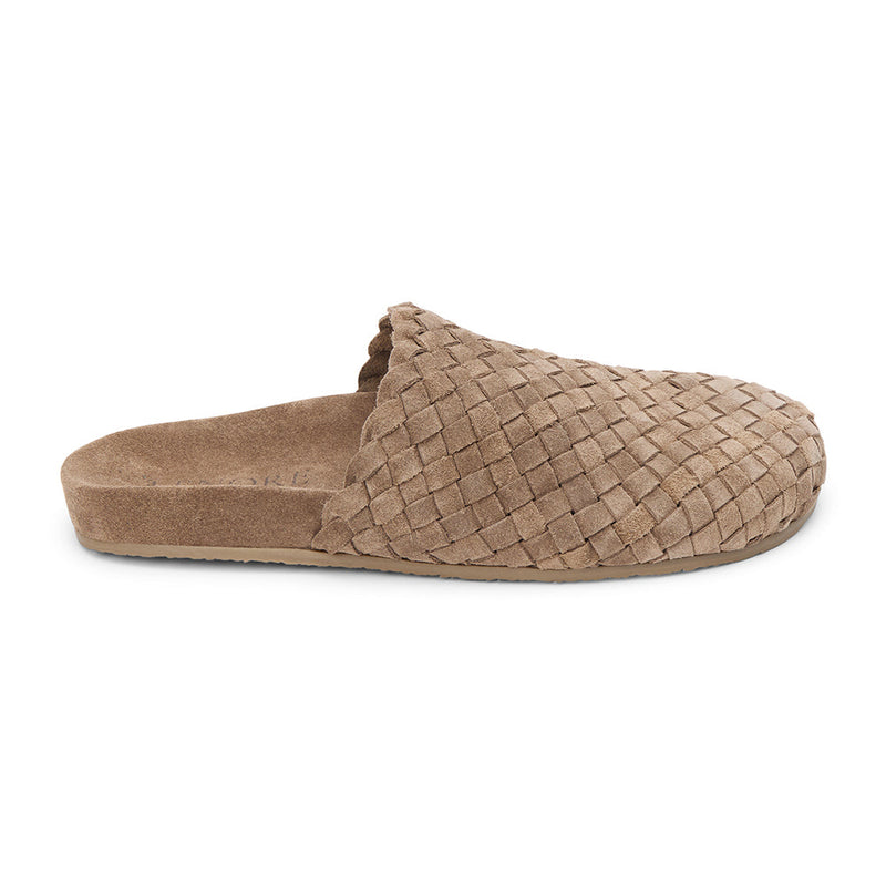 Taupe suede woven mule with a soft texture and cushioned footbed. A cozy yet refined silhouette, perfect for effortless everyday wear.