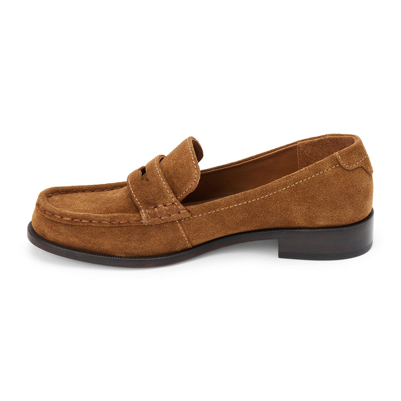 Bourbon suede penny loafers with a polished finish, classic moccasin stitching, and a low stacked heel. A timeless staple for effortless sophistication.